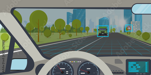 Car interior. Modern car interior with steering wheel and display. AI autopilot view on screen interface. Highway to hill, city on background. Autonomous car interface and road sign identification.