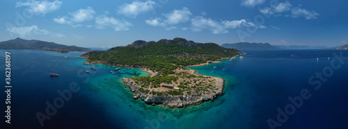 Aerial drone photo of secluded paradise bay and small island of Moni with turquoise crystal clear beach next to Aigina, Saronic gulf, Greece © aerial-drone