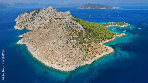 Aerial drone photo of secluded paradise bay and small island of Moni with turquoise crystal clear beach next to Aigina, Saronic gulf, Greece © aerial-drone