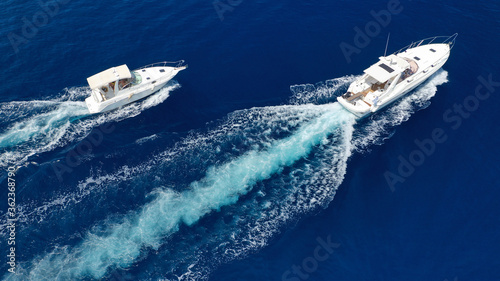 Aerial drone photo of speed boat cruising in high speed in Mediterranean deep blue sea © aerial-drone