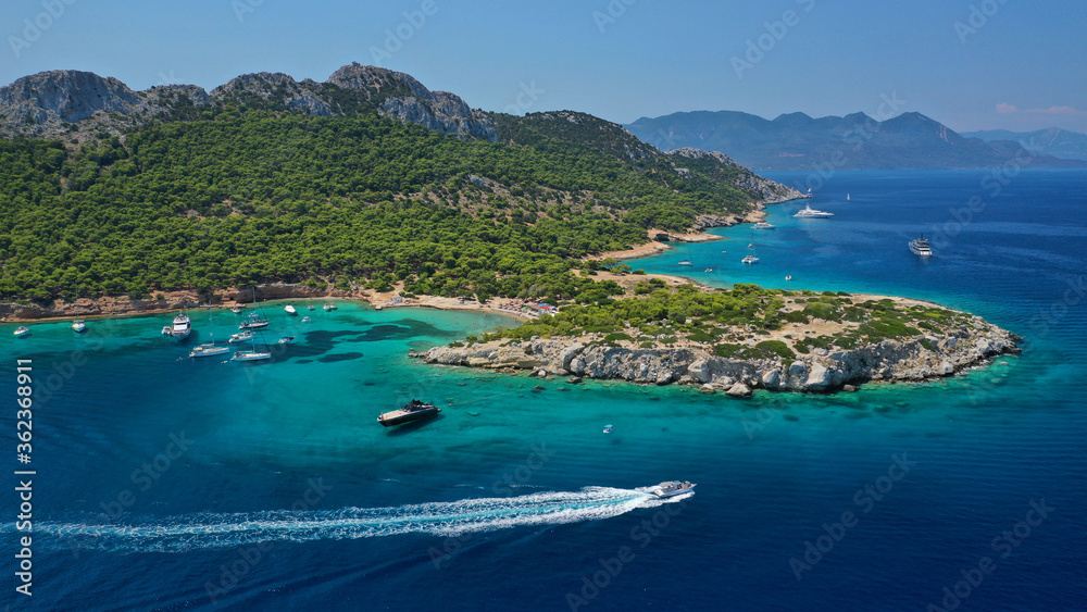 Obraz premium Aerial drone photo of secluded paradise bay and small island of Moni with turquoise crystal clear beach next to Aigina, Saronic gulf, Greece