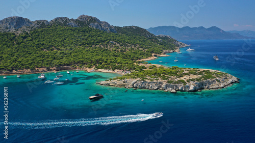 Aerial drone photo of secluded paradise bay and small island of Moni with turquoise crystal clear beach next to Aigina, Saronic gulf, Greece photo