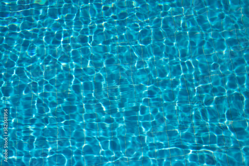 Abstract pool water surface and background with sun light reflection for text copy space