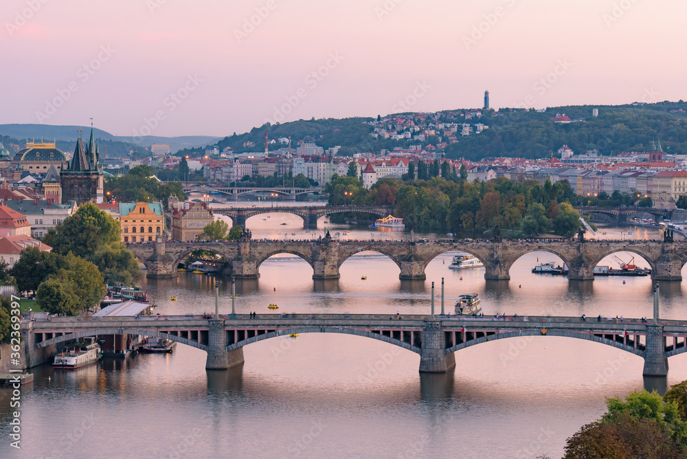 View of three bridges over the River Vltava at sunset time in Prague, Czech Republic