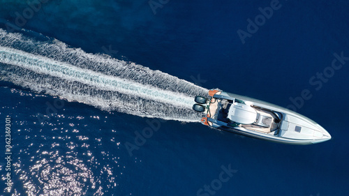 Aerial drone photo of inflatable rib speed boat cruising in mediterranean deep blue sea © aerial-drone