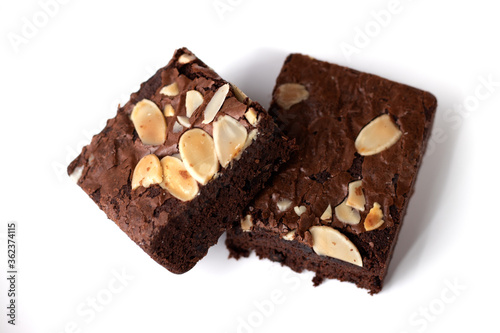 Two almonds brownies on a white background