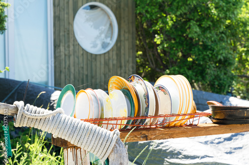 Εκτύπωση καμβά Tableware from different collections in the backyard at the seaside