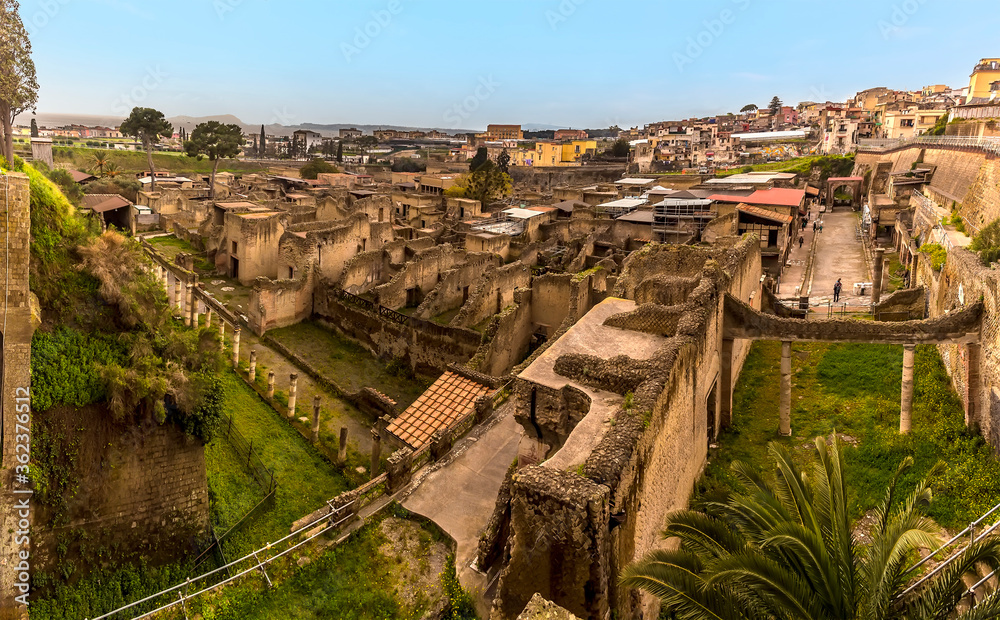A panorama view across the excavated hollow containing the well preserved Roman settlement of Herculaneum, Italy