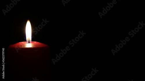 Red candle burning photo