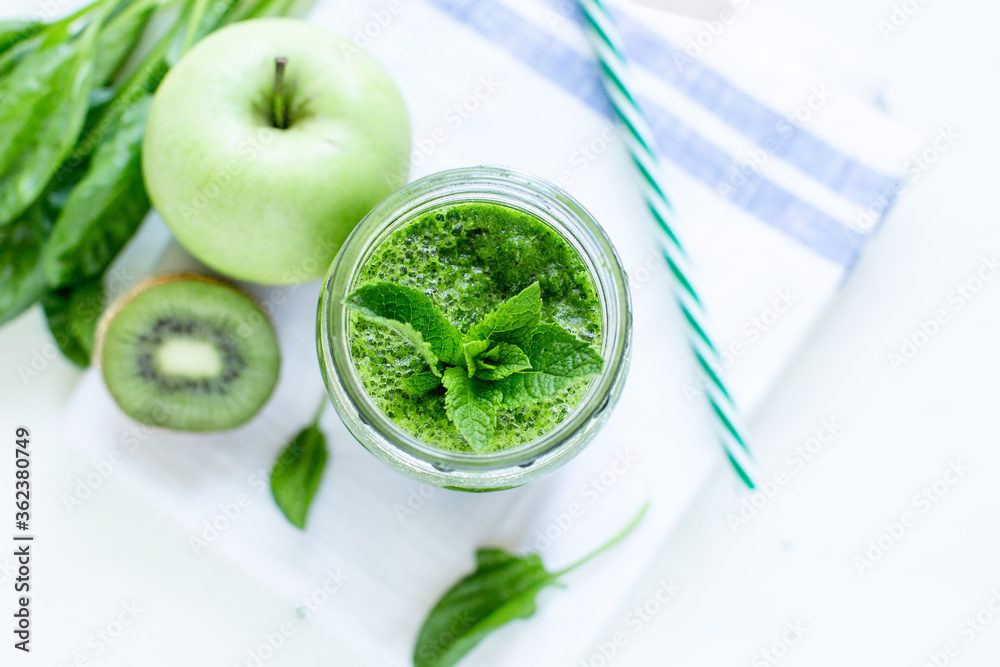 Green smoothie with spinach and apple. Summer and vegan foods and drinks concept. Green smoothie with spinach and apple. Summer and vegan foods and drinks concept.