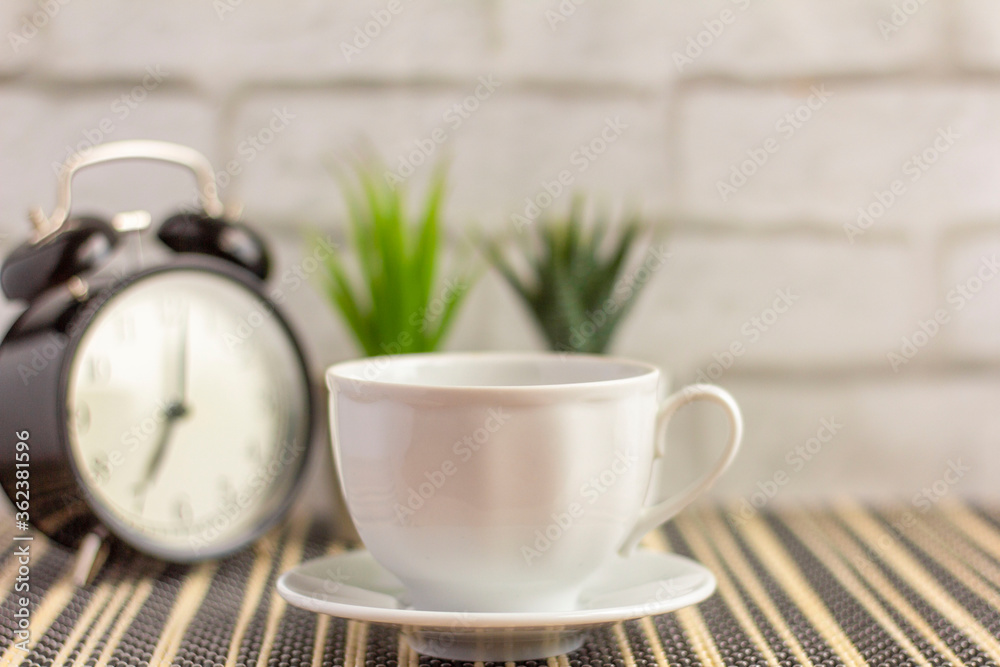 A small coffee Cup of morning coffee on the table. A small coffee Cup of morning coffee on the table.