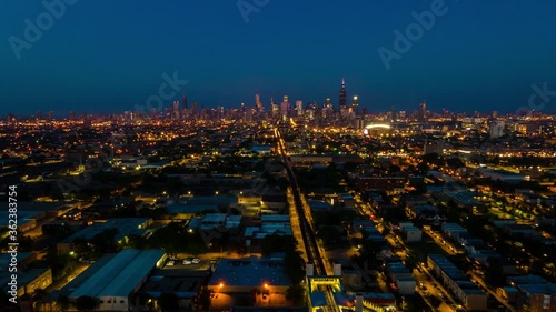 night aerial drone hyper lapse of the city fireworks during 4th of July in Chicago west side neighborhood.  Independence day is a festive day that Americans celebration city wide 
