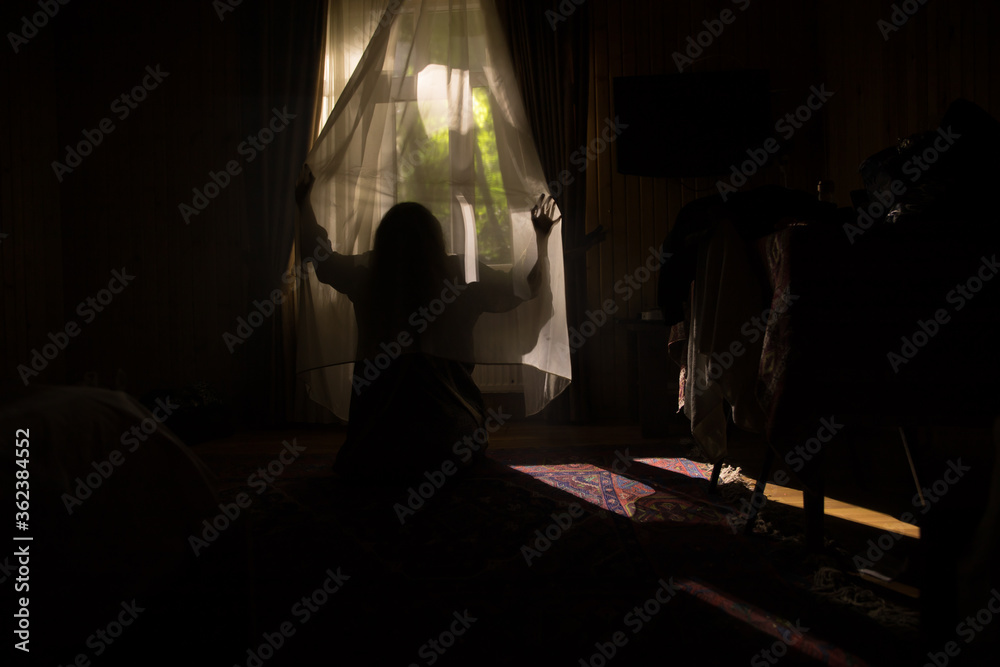Horror woman in window wood hand hold cage scary scene halloween concept Blurred silhouette of witch. Horror theme Horror woman in window wood hand hold cage scary scene halloween concept Blurred silhouette of witch. Horror theme