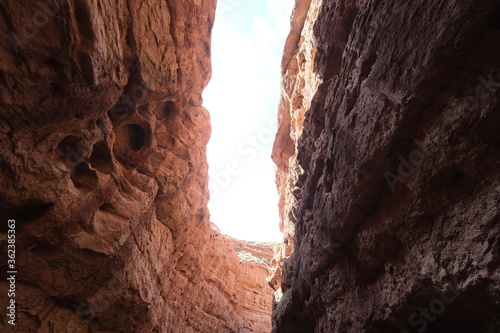 low angle view of bright sunshine between ember color canyon rocks. in Zhangye, Gansu province China.