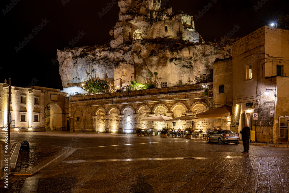 Night view at Church of San Pietro caveoso and on the top of the hill of Church of Saint Mary of Idris in Matera, Basilicata, Italy