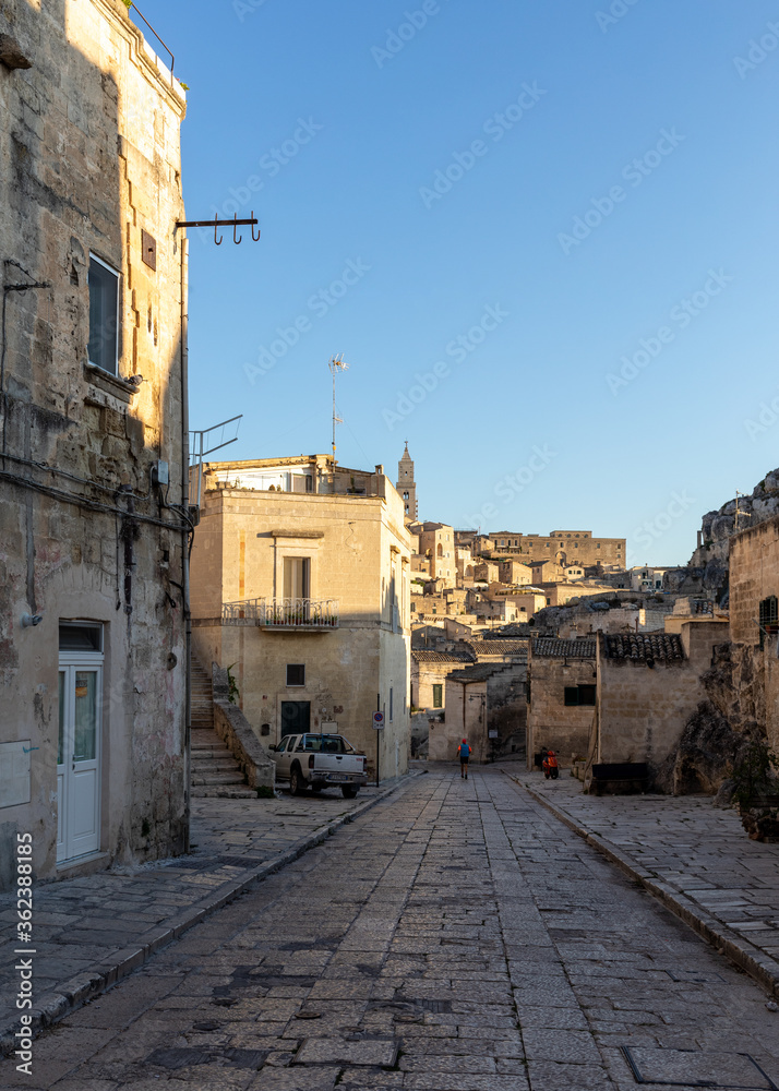 Cobblestone street in the Sassi di Matera a historic district in the city of Matera. Basilicata. Italy