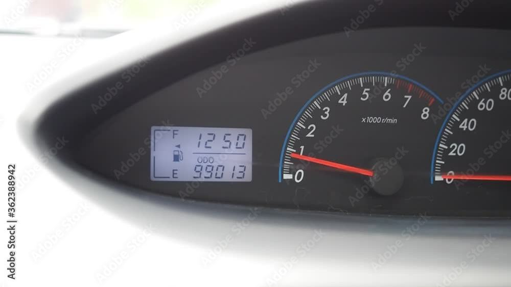 Fuel warning icon blinking. Closeup car dash board petrol meter, fuel gauge. Low level of fuel