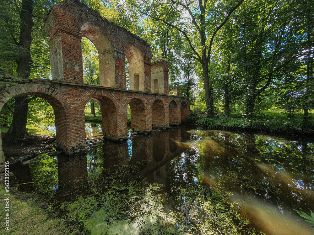 Wide lens view on aqueduct in Arkadia park in Nieborów, Poland