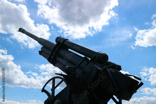 Wallpaper Mural old anti-aircraft gun on cloudy sky background Torontodigital.ca