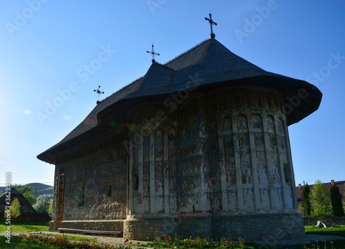 Obraz na płótnie HUMORULUI MONASTERY, BUCOVINA, ROMANIA, EUROPE, SPRING 2018. Orthodox monastery. Moldovan architectural style. Outdoor paintings, frescoes and portraits of saints with Byzantine influence. w salonie