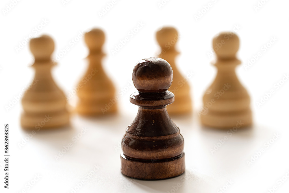 Black chess pawn among whites. Concept of racism and discrimination. Black chess pawn among whites. Concept of racism and discrimination.