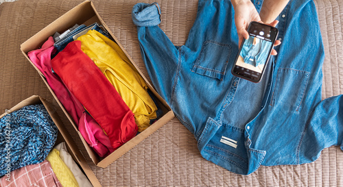 Woman preparing clothes for online clothing sale. The concept of zero pollution and eco-friendly lifestyle