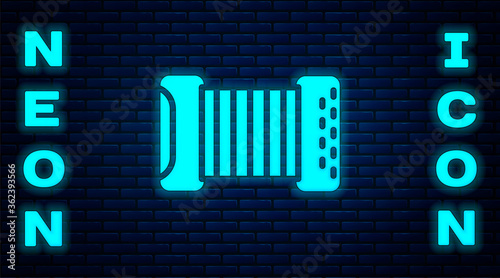 Glowing neon Musical instrument accordion icon isolated on brick wall background. Classical bayan, harmonic. Vector.