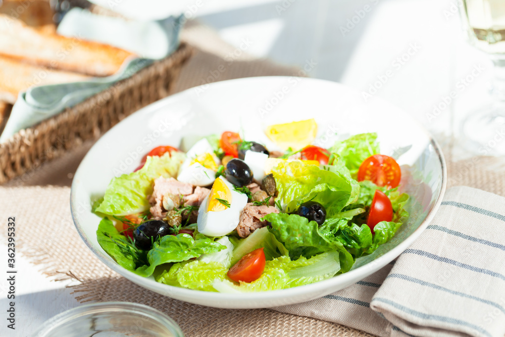 Chef's salad with tuna fish, black olives and egg in caper-mayonaisse sauce. Chef's salad with tuna fish, black olives and egg in caper-mayonaisse sauce.
