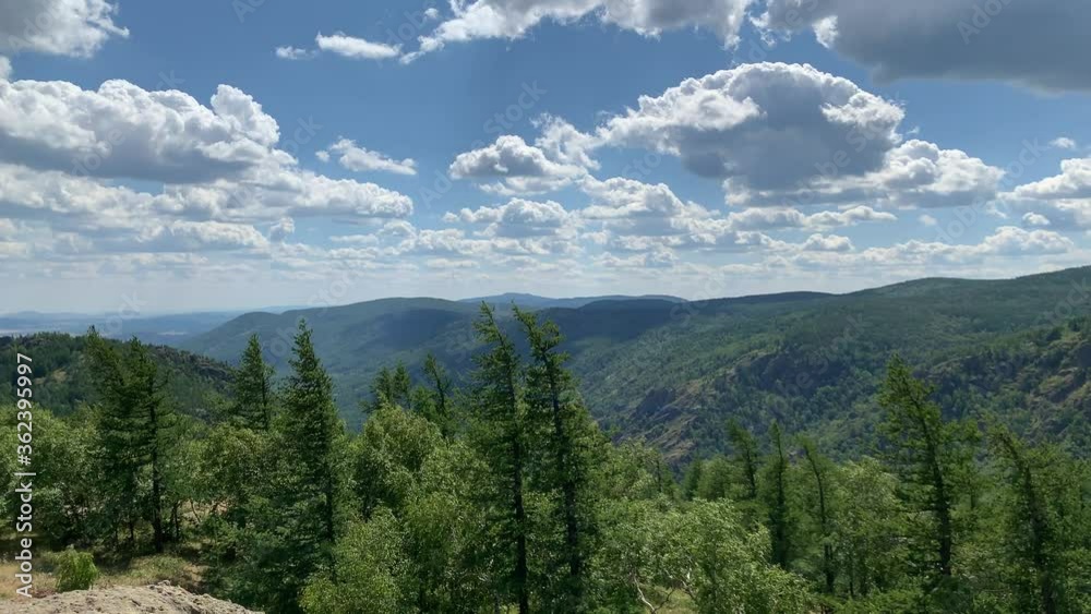 4К Shooting a stunning summer landscape. Panoramic views of mountains, forests and blue sky. A view of a mountain 4К Shooting a stunning summer landscape. Panoramic views of mountains, forests and blue sky. A view of a mountain