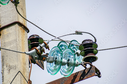 Insulators power substations to protect against high load transmission wires.
