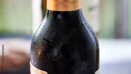 Cuadro en lienzo A bottle of well chilled wine one summer evening