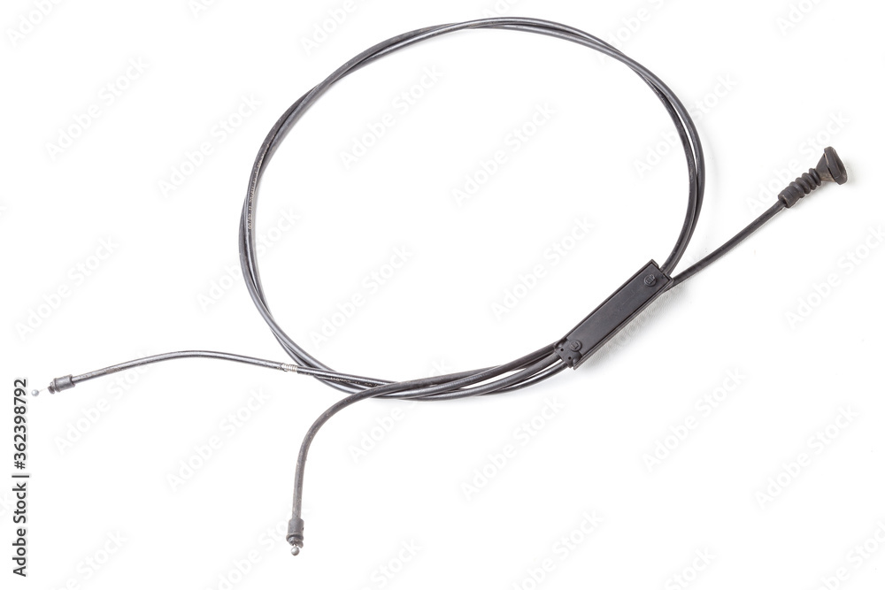 The removed spare part from the car on a white isolated background is a hood opening cable for replacement and repair. Spare parts catalog.