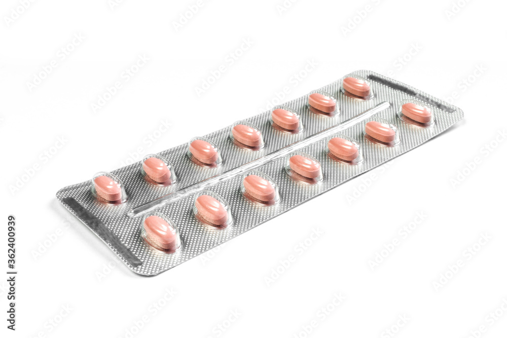 Pack of red pills isolated on white background. Blister package Pack of red pills isolated on white background. Blister package