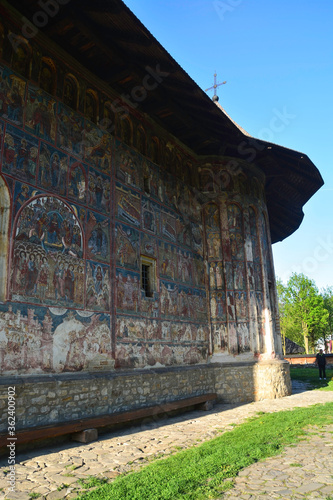Obraz na płótnie HUMORULUI MONASTERY, BUCOVINA, ROMANIA, EUROPE, SPRING 2018. Orthodox monastery. Moldovan architectural style. Outdoor paintings, frescoes and portraits of saints with Byzantine influence. w salonie