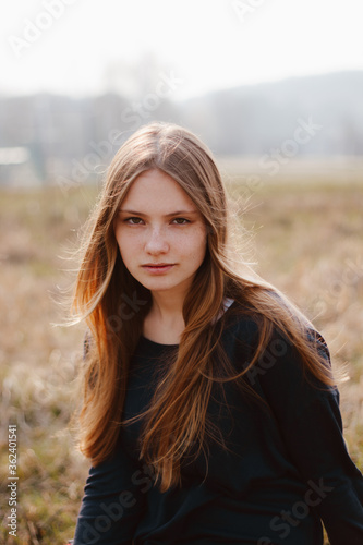 Young girl outside windy portrait