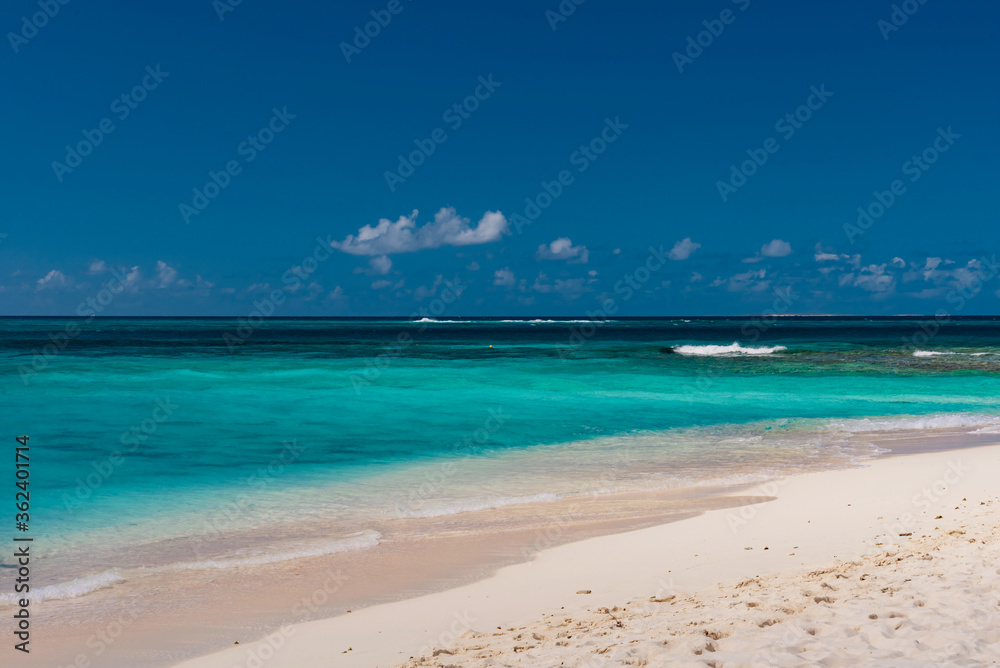 Sandy Island, Caribbean - January 18 2020: small desert atoll in the Caribbean sea Sandy Island, Caribbean - January 18 2020: small desert atoll in the Caribbean sea