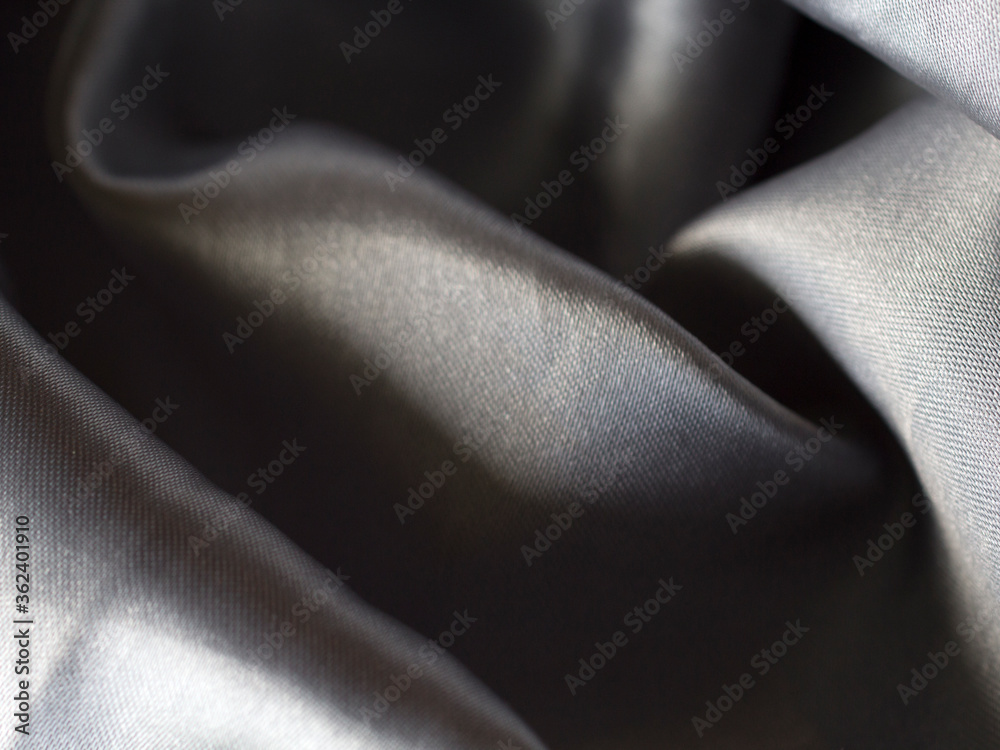 Obraz premium Smooth elegant grey silver silk or satin texture can use as background. silver fabric texture close up