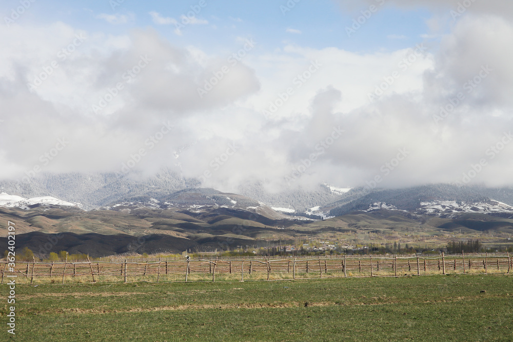 Fototapeta premium Beautiful mountain landscape. Wildlife Kyrgyzstan. Clouds in the sky. Kyrgyzstan