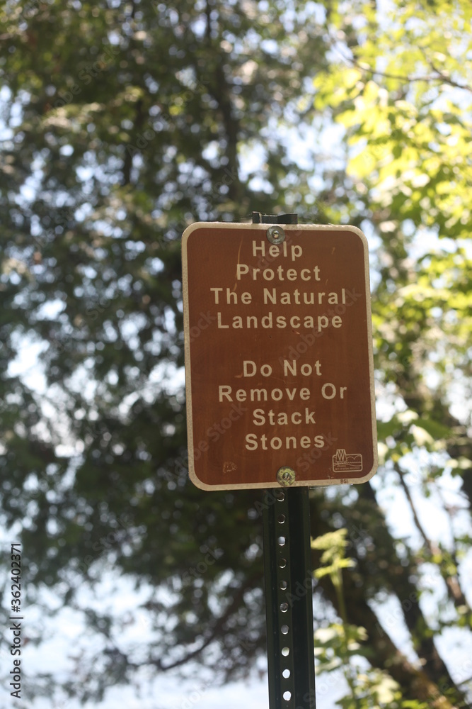 SIGN HELP PROTECT THE NATURAL LANDSCAPE, DO NOT REMOVE OR STACK STONES