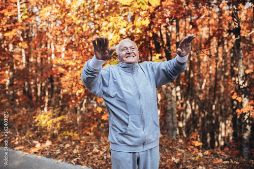 Senior Man Exercising In Park, having fun © Mediteraneo
