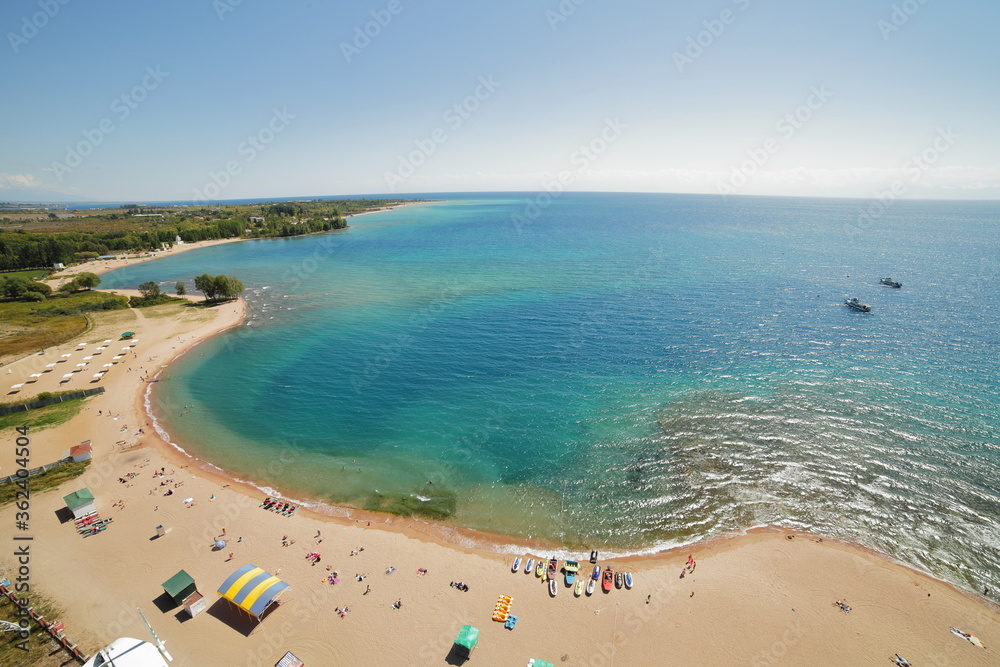 The coast of Lake Issyk-Kul. Blue water, shooting from above.