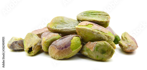 pile of pistachio nuts on white background