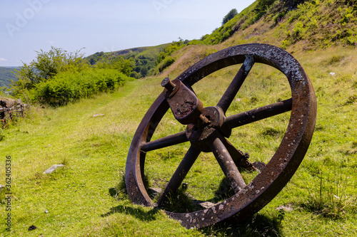 Huge, rusting abandoned flywheel from a Victorian era lifting engine and old Ironworks.  Ebbw Vale, Gwent, Wales, UK photo