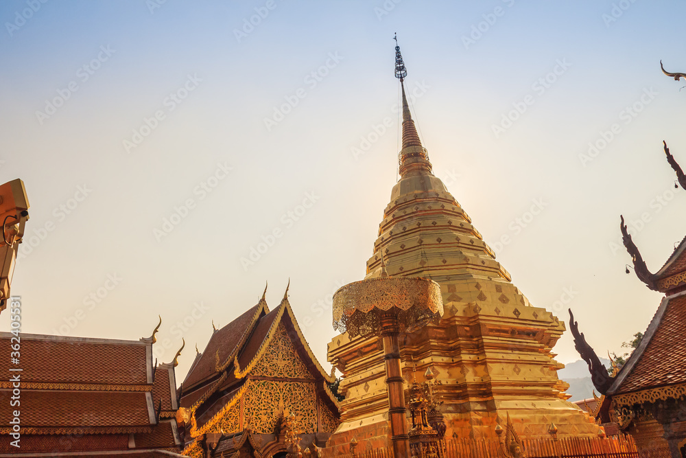 Fototapeta premium Beautiful northern Thai style architectural of golden pagoda with golden umbrella at Wat Phra That Doi Suthep, the famous temple and became the landmark of Chiang Mai, Thailand.