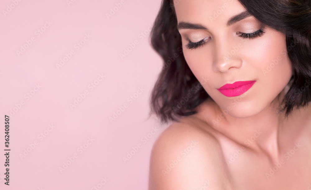 Romantic portrait of young beautiful brunette woman with clean fresh skin, wavy hair style, natural make up and bright pink lips on pink background isolated. Looking aside of the camera. Spa, cosmetic Romantic portrait of young beautiful brunette woman with clean fresh skin, wavy hair style, natural make up and bright pink lips on pink background isolated. Looking aside of the camera. Spa, cosmetic