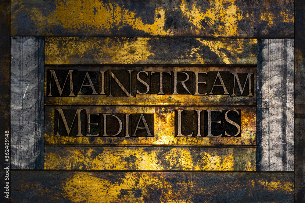 Mainstream Media Lies text formed with real authentic typeset letters on vintage textured silver grunge copper and gold background