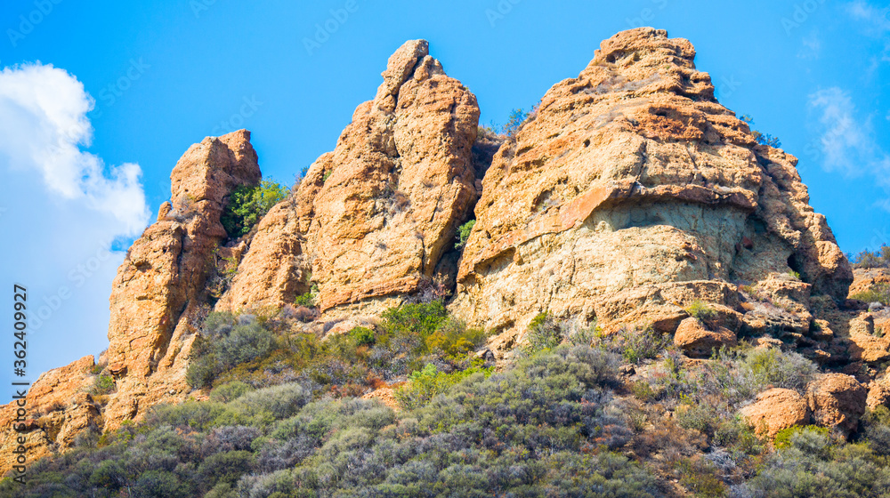 majestic jagged rock peaks on a hillside in the Santa Monica Mountains near Malibu, California on a sunny day