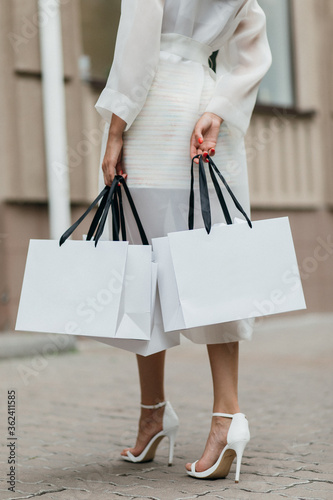 Shopping love. Beautiful happy woman with bags.