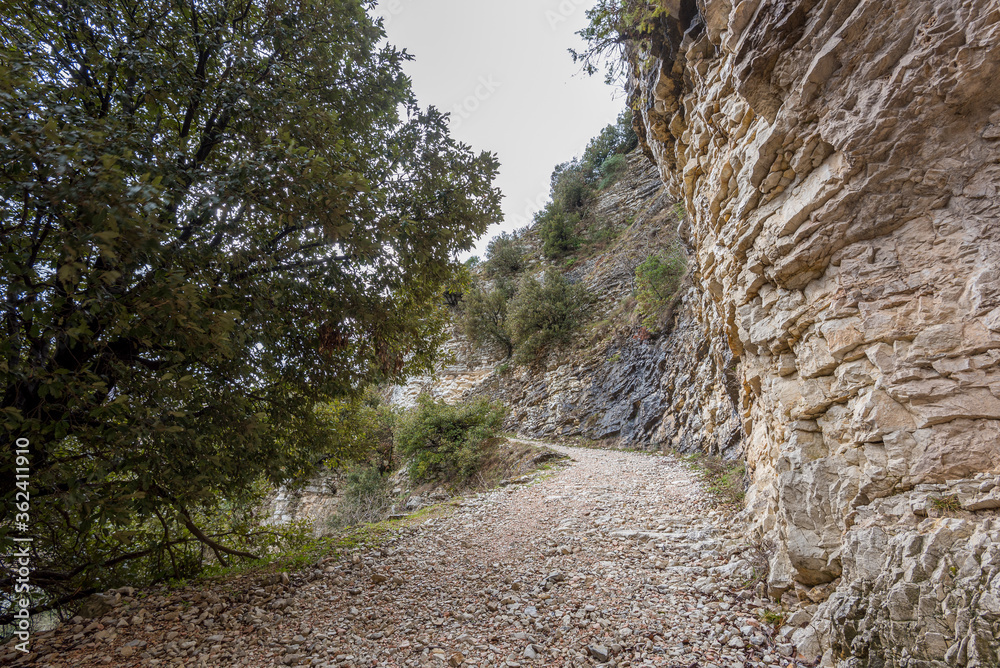 Rocky road with stone wall in the mountains of Italy Rocky road with stone wall in the mountains of Italy