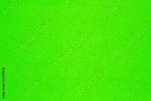 Bright green fleecy textile structured background for design